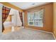 Comfortable living room featuring large windows and neutral carpet for cozy relaxation at 112 Rotherhithe Nw Ln, Marietta, GA 30066