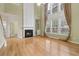 Bright living room with a fireplace, built-in shelves, and large windows with elegant curtains at 112 Rotherhithe Nw Ln, Marietta, GA 30066