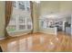 Open-concept living room flowing into a modern kitchen with hardwood floors at 112 Rotherhithe Nw Ln, Marietta, GA 30066