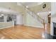 Open-concept living space featuring hardwood floors, a staircase, and neutral wall color at 112 Rotherhithe Nw Ln, Marietta, GA 30066