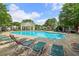 Inviting community pool with lounge chairs for relaxation and enjoyment under the sun at 112 Rotherhithe Nw Ln, Marietta, GA 30066