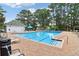 Well-kept community pool with ample seating and a clear blue swimming area at 112 Rotherhithe Nw Ln, Marietta, GA 30066