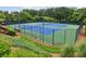 Well-maintained community tennis courts surrounded by lush landscaping and greenery at 112 Rotherhithe Nw Ln, Marietta, GA 30066