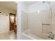 Bathroom featuring a shower-tub combo and a glimpse of the vanity area at 335 Whisper Way, Dacula, GA 30019