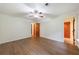 Spacious bedroom with hardwood floors, ceiling fan, and wood doors at 335 Whisper Way, Dacula, GA 30019