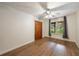 Bright bedroom with wood floors, a ceiling fan, and large windows at 335 Whisper Way, Dacula, GA 30019