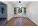 Inviting dining area with bay windows and hardwood flooring at 335 Whisper Way, Dacula, GA 30019