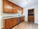 Kitchen with wood cabinets, granite countertops, stainless steel appliances, and wood floors at 335 Whisper Way, Dacula, GA 30019