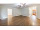 Open living room with wood floors and a decorative front door at 335 Whisper Way, Dacula, GA 30019