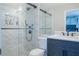 Modern bathroom featuring a large tiled shower, a glass door, and sleek fixtures at 3497 Mount Vernon Cir, Atlanta, GA 30340