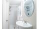 Charming bathroom with pedestal sink, tiled shower and stylish fixtures, offers a cozy, functional space at 3497 Mount Vernon Cir, Atlanta, GA 30340
