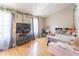 Bright bedroom with wood floors, two large windows, and a cozy decor at 3497 Mount Vernon Cir, Atlanta, GA 30340