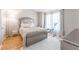 Bright bedroom featuring wood floors, a plush rug, and modern decor with an abundance of natural light at 3497 Mount Vernon Cir, Atlanta, GA 30340