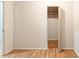 Neutral-toned bedroom features an open closet showcasing an inviting, clean space with durable wood flooring at 3497 Mount Vernon Cir, Atlanta, GA 30340