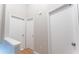 Upstairs hallway with hardwood floors, complemented by clean white doors and trim, adding a modern touch at 3497 Mount Vernon Cir, Atlanta, GA 30340