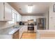 Modern kitchen with stainless steel appliances, granite countertops, and ample cabinetry at 3497 Mount Vernon Cir, Atlanta, GA 30340