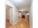 Open floor plan with hardwood floors, fireplace, and view into kitchen area at 3497 Mount Vernon Cir, Atlanta, GA 30340