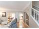 Open-concept living area with hardwood floors, natural light, and staircase at 3497 Mount Vernon Cir, Atlanta, GA 30340