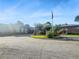 Exterior entrance of the community building with drive up and landscaped areas at 475 Mount Vernon Ne Hwy # C230, Sandy Springs, GA 30328