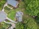 Overhead aerial view of a home with circular driveway, lush greenery and mature trees at 992 Marbury Sw Ct, Marietta, GA 30064