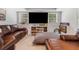 The basement features a large entertainment center with leather couches, a side table and a large screen TV at 992 Marbury Sw Ct, Marietta, GA 30064