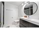 Modern bathroom featuring black and white tile in shower with updated vanity and finishes at 992 Marbury Sw Ct, Marietta, GA 30064