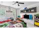 room with two beds, study desk and a television styled with a gaming theme at 992 Marbury Sw Ct, Marietta, GA 30064
