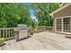 Outdoor deck with a stainless steel grill and seating area, perfect for entertaining at 992 Marbury Sw Ct, Marietta, GA 30064