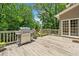 Outdoor deck with a stainless steel grill and an area to relax and enjoy outdoor meals at 992 Marbury Sw Ct, Marietta, GA 30064