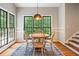 Bright dining room with large windows, a wood table, and views of the landscape at 992 Marbury Sw Ct, Marietta, GA 30064