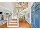 Grand foyer with hardwood floors, a staircase, and views into the dining and living areas at 992 Marbury Sw Ct, Marietta, GA 30064