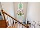 Grand foyer view from the second floor, with a chandelier and front door access at 992 Marbury Sw Ct, Marietta, GA 30064