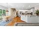 Open kitchen with white cabinets, granite countertops, stainless appliances, and breakfast bar at 992 Marbury Sw Ct, Marietta, GA 30064