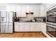Modern kitchen with stainless steel appliances, granite countertops, and white cabinets at 992 Marbury Sw Ct, Marietta, GA 30064