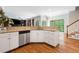 Bright open kitchen with granite counters, stainless dishwasher, and view to the living room at 992 Marbury Sw Ct, Marietta, GA 30064