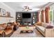 Inviting living room with a fireplace, built-in shelves, comfortable seating and natural light at 992 Marbury Sw Ct, Marietta, GA 30064