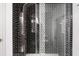 Stylish black and white tiled shower with a glass door and rainfall shower head at 992 Marbury Sw Ct, Marietta, GA 30064