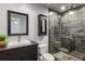 This renovated bathroom includes an enclosed shower, square sink and modern cabinets at 1002 Defoors Nw Lndg, Atlanta, GA 30318