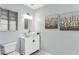 Elegant bathroom featuring a modern vessel sink, stylish light fixture, and beautiful floral artwork at 1002 Defoors Nw Lndg, Atlanta, GA 30318