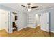 This bedroom has beautiful hardwood floors and access to a bathroom and closet at 1002 Defoors Nw Lndg, Atlanta, GA 30318