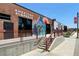 Exterior view of American Axes with colorful murals, showcasing an inviting, vibrant urban entertainment destination at 1002 Defoors Nw Lndg, Atlanta, GA 30318