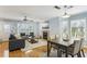 Open-concept living and dining area featuring hardwood floors and natural light at 1002 Defoors Nw Lndg, Atlanta, GA 30318