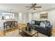 Spacious living room with hardwood floors that flows into the kitchen at 1002 Defoors Nw Lndg, Atlanta, GA 30318