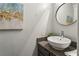 Stylish powder room with a vessel sink and decorative wall art at 1002 Defoors Nw Lndg, Atlanta, GA 30318