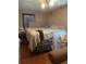 Comfortable bedroom with hardwood floors, natural lighting, and a cozy atmosphere at 36 Wolf Pen Path, Dallas, GA 30157