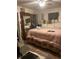 Main bedroom featuring a plush bed, a large mirror, and ambient lighting for a restful retreat at 36 Wolf Pen Path, Dallas, GA 30157