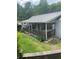 Inviting home featuring a charming covered front porch with a wood railing and landscaped yard at 36 Wolf Pen Path, Dallas, GA 30157