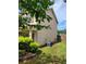 Side view of home featuring lawn and AC unit at 948 Regency Dr, Lawrenceville, GA 30044