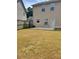 Fenced backyard with door to back of home and patio at 948 Regency Dr, Lawrenceville, GA 30044