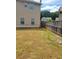 Spacious backyard features a privacy fence and offers potential for outdoor activities at 948 Regency Dr, Lawrenceville, GA 30044